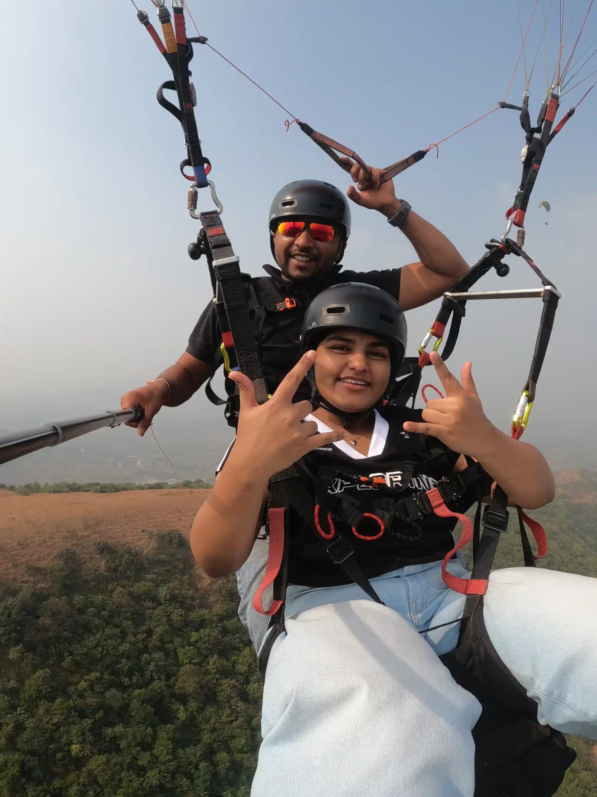 Aerial view of Pawna Lake from a paraglider